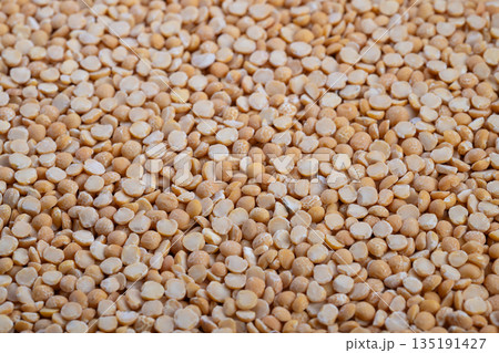 Peas in packaging, Visual depiction of peas used in processing and distribution, Detailed image highlighting yellow split peas within supply chain and packaging environment 135191427