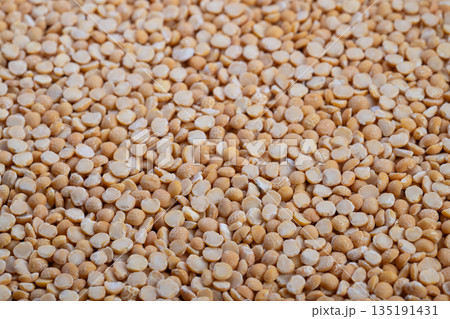 Vegan meal with fiber and iron, Closeup of split peas ideal for plant based nutrition, High fiber and iron plant protein ingredient suitable for vegan meal preparation Vegan meal with fiber and iron, Closeup of split peas ideal for plant based nutrition, High fiber and iron plant protein ingredient suitable for vegan meal preparation 135191431