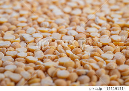 Premium organic split peas, gourmet ingredient showcased for chefdriven recipes and artisanal brands, elevated styling with selective focus and luxurious natural tones Premium organic split peas, gourmet ingredient showcased for chefdriven recipes and artisanal brands, elevated styling with selective focus and luxurious natural tones 135191514