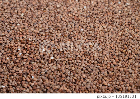 Detailed macro image showcasing buckwheat kernels and lighting effects, Sharp macro photograph emphasizing texture and subtle variations of buckwheat organic grains Detailed macro image showcasing buckwheat kernels and lighting effects, Sharp macro photograph emphasizing texture and subtle variations of buckwheat organic grains 135191531