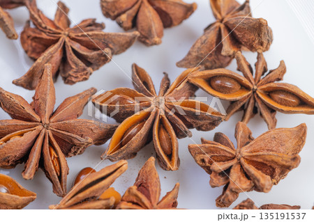 Dried star anise seeds enhance calming herbal infusions and teas, Aromatic star anise pods carefully arranged for soothing herbal infusions and calming tea rituals 135191537
