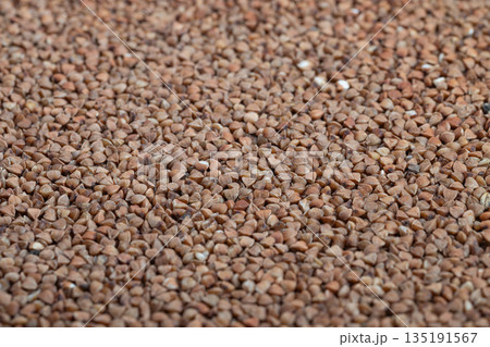 Warm toned flat buckwheat pattern design, Detailed image of buckwheat groats with consistent pattern and natural warm tones suitable for product labels and banners Warm toned flat buckwheat pattern design, Detailed image of buckwheat groats with consistent pattern and natural warm tones suitable for product labels and banners 135191567