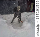 Shoveling Heavy Snow During a Winter Storm 135191599