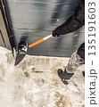 Clearing Snow from a Garage Door 135191603