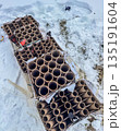 Aftermath of a Firework Display in the Snow 135191604