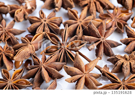 Star anise detailed, Focus on natural textures and aromatic features of star anise pods, Illustration emphasizing intricate woody texture and fragrant qualities of star anise 135191628