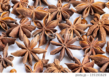 Flavorful spice accents, Add visual appeal through spices and textured seed decorations, Incorporate star anise and seeds to elevate baking aesthetics and taste experience 135191629