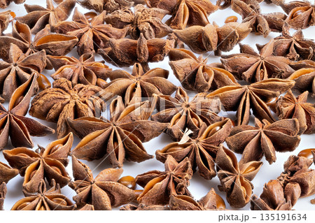 Rustic herbal tea component display, Closeup of dried anise seeds showcased, Rustic apothecary style photograph emphasizing calming herbal tea components with earthy aroma 135191634