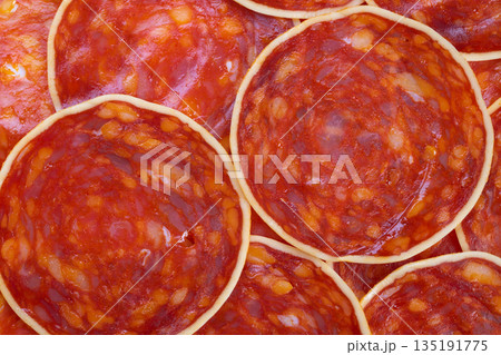 Spicy sausage details, Macro photograph showcasing spicy sausage skin texture, Highresolution macro image capturing intricate surface details of seasoned chorizo sausage 135191775