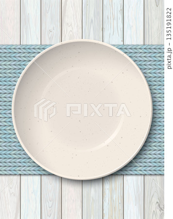 Top view of empty ivory bowl with with grainy texture placed on a light blue placemat on cut timber panel vertical background 135191822