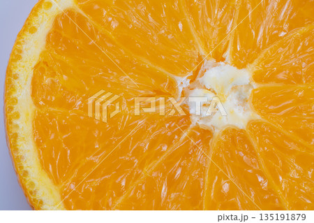 Zoomedin view showcasing juicy pulp and fibrous core of orange, Highly detailed photograph emphasizing glossy pulp and vibrant color of freshly cut orange slice Zoomedin view showcasing juicy pulp and fibrous core of orange, Highly detailed photograph emphasizing glossy pulp and vibrant color of freshly cut orange slice 135191879