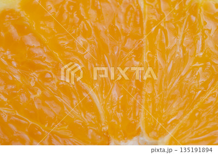 Fruit textured background, Orange pulp with glossy highlights, Repeating pulp motifs on warm tone surface, Design backdrop featuring glossy orange pulp texture with warm colors 135191894