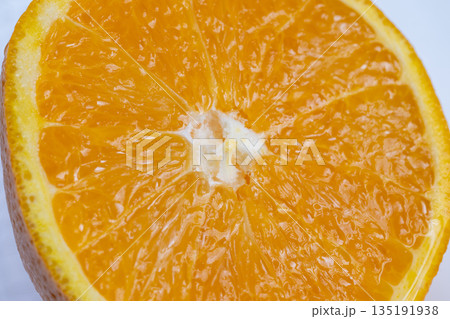 Juicy citrus closeup, Vivid orange slice with juice, Bright citrus segment with glossy pulp and zest, Fresh orange piece with sparkling juice droplets and vibrant peel Juicy citrus closeup, Vivid orange slice with juice, Bright citrus segment with glossy pulp and zest, Fresh orange piece with sparkling juice droplets and vibrant peel 135191938