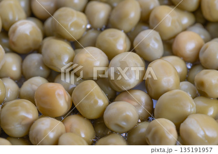 Closeup of canned peas for nutritional analysis presentation, Detailed display of canned peas illustrating dietary benefits through closeup nutritional evaluation illustrations 135191957