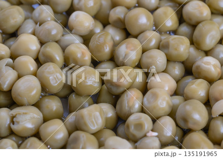 Canned peas as culinary decoration, Studio lighting highlights glossy pea spheres, Chef meticulously arranges canned peas with shine for attractive plated presentation Canned peas as culinary decoration, Studio lighting highlights glossy pea spheres, Chef meticulously arranges canned peas with shine for attractive plated presentation 135191965
