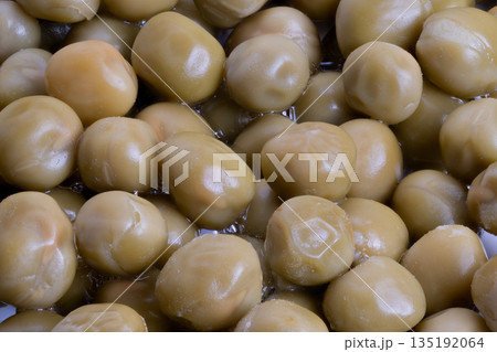 Glistening canned peas closeup, Close detail of oilcoated canned peas with reflections, Highly detailed macro shot of shiny canned peas with moist surface and highlights Glistening canned peas closeup, Close detail of oilcoated canned peas with reflections, Highly detailed macro shot of shiny canned peas with moist surface and highlights 135192064