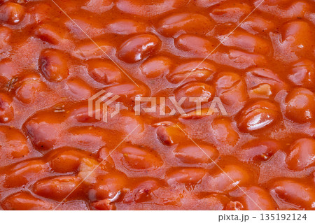 Rich protein meal presentation, Prepared red beans with thick sauce in kitchen setting, Detailed view of nutritious vegan beans with savory sauce ready to serve Rich protein meal presentation, Prepared red beans with thick sauce in kitchen setting, Detailed view of nutritious vegan beans with savory sauce ready to serve 135192124