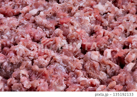 Ground meat with marbling ready, Detailed view of ground meat with even fat distribution, Closeup of minced meat showcasing marbling suitable for meal preparation and cooking Ground meat with marbling ready, Detailed view of ground meat with even fat distribution, Closeup of minced meat showcasing marbling suitable for meal preparation and cooking 135192133