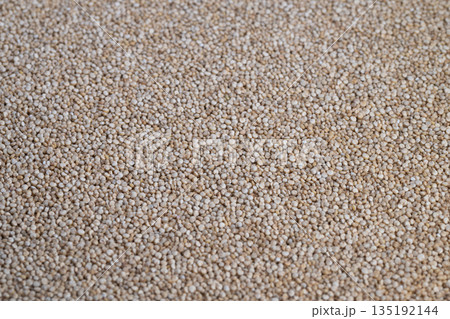 Highprotein white quinoa seeds for plantbased diets and nutrition plans, concept image for dietitian and wellness content, fiber and energy focus, clean eating message 135192144