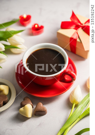 Valentine's day. Cup of coffee, heart chocolates, gift box and spring white tulip flower bouquet. Mother's day 135192242