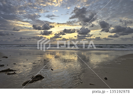 Sunrise at Frazer Islands with a cloudy sky 135192978