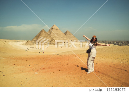 Woman Tourist Enjoying The View Of The Pyramids 135193075