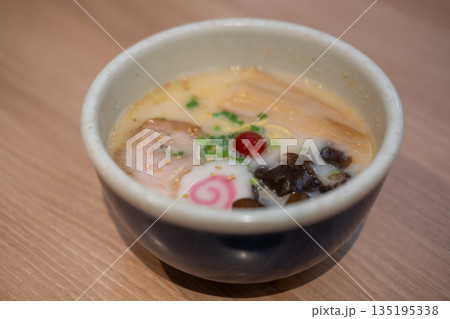 Ramen, a Japanese noodle dish with chashu, a tender braised pork belly as its topping. 135195338