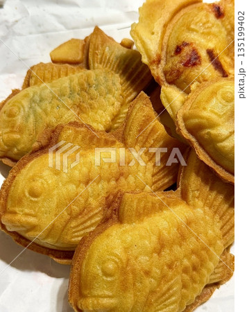 Bungeoppang, bungeo-ppang (Korean Fish Shaped Pastry), popular snack, cookies, sweet in winter streets of Korea. Bungeoppang Korean traditional national food, dish, cuisine. Japanese taiyaki Bungeoppang, bungeo-ppang (Korean Fish Shaped Pastry), popular snack, cookies, sweet in winter streets of Korea. Bungeoppang Korean traditional national food, dish, cuisine. Japanese taiyaki 135199402