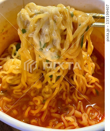 Spicy Shin ramyeon with bold, flavorful broth, served alongside fresh kimbap and tangy kimchi. A perfect trio of comforting, savory, and spicy Korean favorites in every bite. 135199407