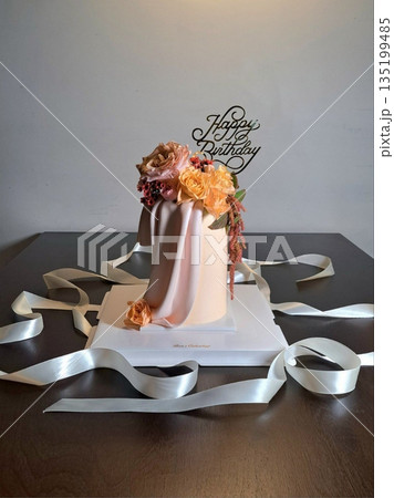 Elegant cake topped with delicate edible flower decorations, offering a perfect blend of soft, sweet layers and natural floral beauty in every slice—ideal for celebrations and special moments. Elegant cake topped with delicate edible flower decorations, offering a perfect blend of soft, sweet layers and natural floral beauty in every slice—ideal for celebrations and special moments. 135199485