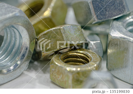 Assorted galvanized hex nuts of various sizes Assorted galvanized hex nuts of various sizes 135199830