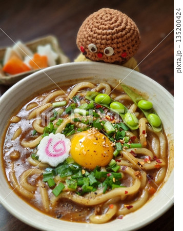 Thick, chewy udon noodles in a rich and savory Japanese curry sauce, topped with green onions and your choice of protein. A comforting dish with bold, hearty flavors. 135200424