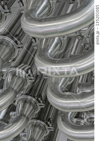 A lot of shiny curved stainless steel pipes of industrial equipment cooling system A lot of shiny curved stainless steel pipes of industrial equipment cooling system 135201085