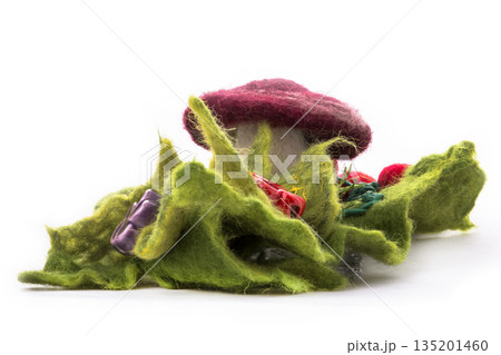 Brooch made of felt wool on a white background Brooch made of felt wool on a white background 135201460