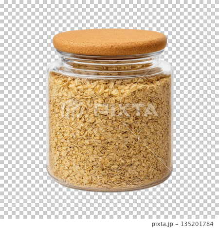 Glass jar filled with dry rolled oats with cork lid, perfect for healthy breakfast storage and natural kitchen organization 135201784