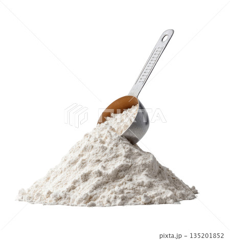 Flour pile with metal measuring scoop resting on top, showing fine white powder texture for baking and cooking use 135201852