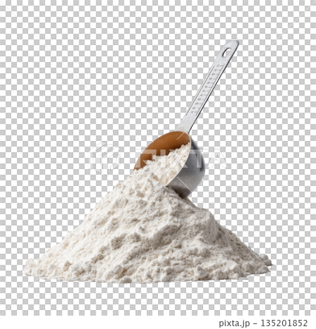 Flour pile with metal measuring scoop resting on top, showing fine white powder texture for baking and cooking use 135201852