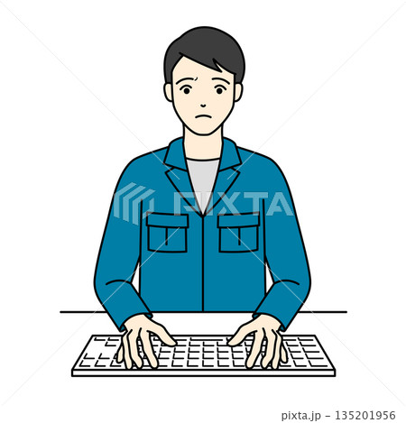 パソコン作業中に困った表情でキーボードを叩く作業着の男性 135201956