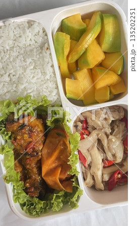 A traditional Korean dosirak, beautifully arranged with rice, assorted banchan, and savory proteins. Balanced and visually inviting, it’s a portable meal packed with vibrant flavors. A traditional Korean dosirak, beautifully arranged with rice, assorted banchan, and savory proteins. Balanced and visually inviting, it’s a portable meal packed with vibrant flavors. 135202251