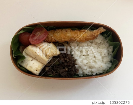 A traditional Korean dosirak, beautifully arranged with rice, assorted banchan, and savory proteins. Balanced and visually inviting, it’s a portable meal packed with vibrant flavors. A traditional Korean dosirak, beautifully arranged with rice, assorted banchan, and savory proteins. Balanced and visually inviting, it’s a portable meal packed with vibrant flavors. 135202276