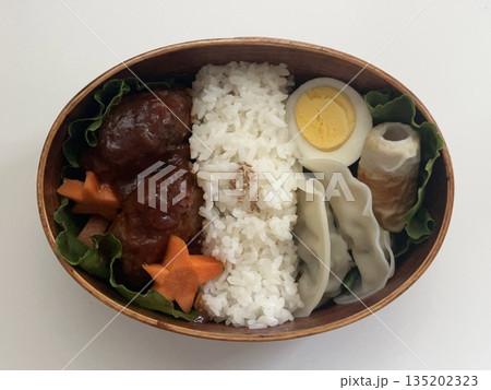 A traditional Korean dosirak, beautifully arranged with rice, assorted banchan, and savory proteins. Balanced and visually inviting, it’s a portable meal packed with vibrant flavors. A traditional Korean dosirak, beautifully arranged with rice, assorted banchan, and savory proteins. Balanced and visually inviting, it’s a portable meal packed with vibrant flavors. 135202323