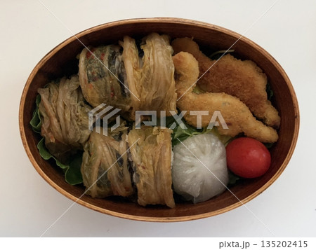 A traditional Korean dosirak, beautifully arranged with rice, assorted banchan, and savory proteins. Balanced and visually inviting, it’s a portable meal packed with vibrant flavors. A traditional Korean dosirak, beautifully arranged with rice, assorted banchan, and savory proteins. Balanced and visually inviting, it’s a portable meal packed with vibrant flavors. 135202415