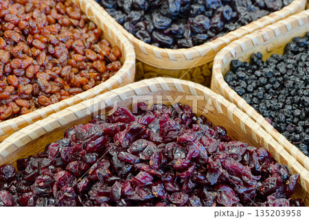 Dried forest berries in a baskets 135203958