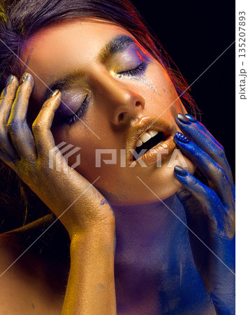Creative art makeup. Close-up studio portrait of young fashion model 135207893