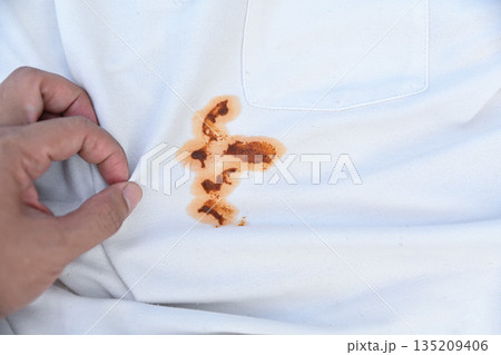 dirty spicy sauce stain on shirt from stain cleaning concept dirty spicy sauce stain on shirt from stain cleaning concept 135209406