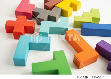 Logical thinking and problem solving problem solution creative business, wooden puzzle geometric block shape. Logical thinking and problem solving problem solution creative business, wooden puzzle geometric block shape. 135209602