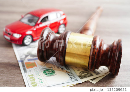 Bangkok, Thailand March 15, 2024 Car accident lawsuit and insurance, Judge hammer and money with car model. 135209621