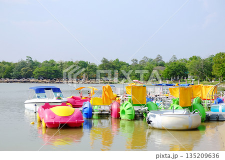 Colorful pedal boat on the river in the park in Thailand Colorful pedal boat on the river in the park in Thailand 135209636