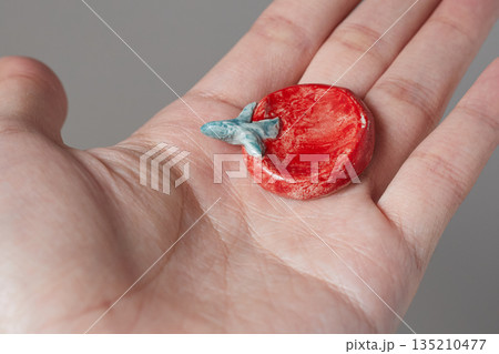 worry stone healing on gray background 135210477