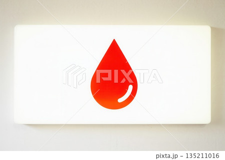Red Drop Symbol on White Background for Health Awareness 135211016